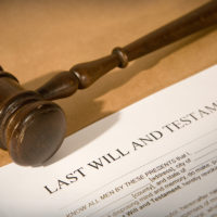 will contest concept - last will and testament form with gavel