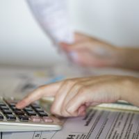 Woman calculates value of receipts for taxation purposes