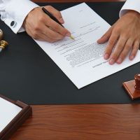 Notary public signing document in office